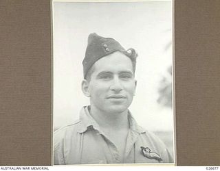 MILNE BAY, PAPUA. 1942-09. FLIGHT-SERGEANT M. BURVILL SERVING WITH 76 FIGHTER SQUADRON RAAF IN NEW GUINEA