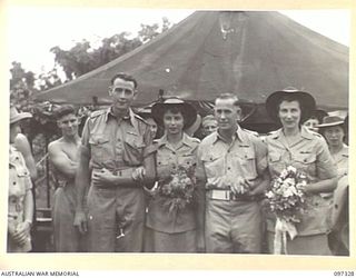 BOUGAINVILLE. 1945-09-29. DRIVER T. WILSON, GROOM (3) WITH HIS BRIDE PRIVATE M. WILSON (4), WITH THEIR ATTENDANTS DRIVER E. CHAPMAN, BEST MAN (1) AND LANCE CORPORAL M. GROUSE, BRIDESMAID (2), AFTER ..