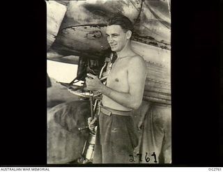 AITAPE, NORTH EAST NEW GUINEA. C. 1944-06. LEADING AIRCRAFTMAN SYD GRISBROOK OF QLD WHO HAS BEEN WITH THE AUSTRALIAN BEAUFORT AIRCRAFT IN NEW GUINEA SINCE 1943-12. HE IS ONE OF THE GROUND MEN WHO ..