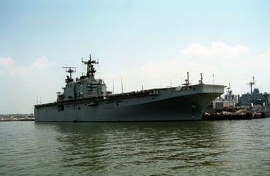 A starboard bow view of the amphibious assault ship USS SAIPAN (LHA-2) tied up at pier 21. The SAIPAN has returned to Norfolk following deployment to the Persian Gulf area during Operation Desert Storm.