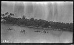 Several people on canoes