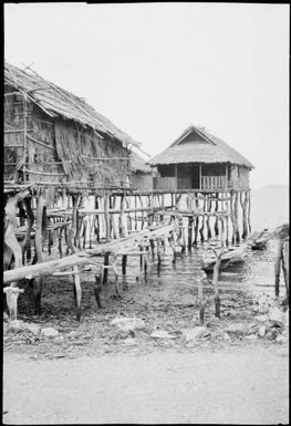View from the shore of houses built out into the water, Papua, ca. 1923 / Sarah Chinnery