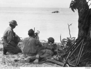 KIRIWINA, TROBRIAND ISLANDS, PAPUA. 1944-01-31. IN MODERN WARFARE, AERODROME DEFENCE IS VITAL AND THE RAAF HAS TRAINED A NUMBER OF "TOUGH GUYS" TO LOOK AFTER ITS POSSESSIONS. AIRFIELD GUARDS HAVE ..