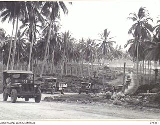 MADANG, NEW GUINEA. 1944-08-15. A CONVOY OF 57 TRUCKS FROM THE 165TH GENERAL TRANSPORT COMPANY PROCEEDING TO GUM VILLAGE TO PICK UP NATIVE LABOURERS. EACH MORNING AND EVENING THIS CONVOY TRANSPORTS ..