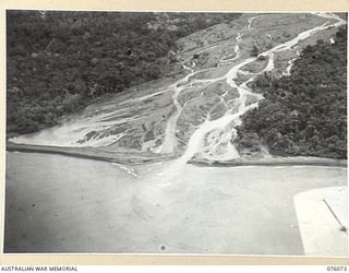 LAE, NEW GUINEA. 1944-09-19. TROOPS OF THE 19TH INFANTRY BATTALION CROSSING A 60 FOOT SUSPENSION BRIDGE CONSTRUCTED BY THE 12TH FIELD COMPANY, ROYAL AUSTRALIAN ENGINEERS, ACROSS THE BUSO RIVER ..