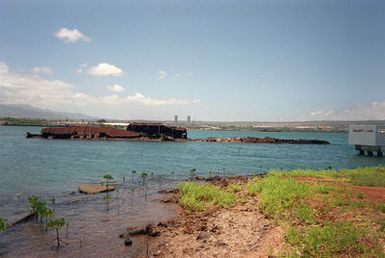 A view of the hulk of the former battleship/target ship USS UTAH (BB-31/AG-16) sunk at her moorings on the north side of Ford Island during the opening minutes of Japans surprise attack on Pearl Harbor on 7 December 1941