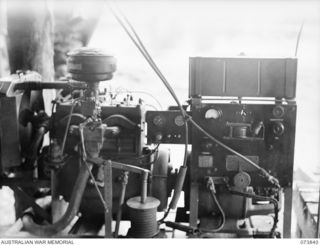 LABU, NEW GUINEA. 1944-06-17. A JEEP ENGINE GOVERNOR FITTED TO A CLAYTON AND JOEL WELDING SET BY MEMBERS OF 1ST WATERCRAFT WORKSHOP, AUSTRALIAN ELECTRICAL AND MECHANICAL ENGINEERS