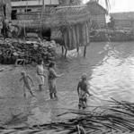 Matthew Hooper out fishing with friends. Sea latrine in background