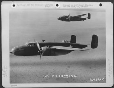 Two North American B-25C'S Of The 42Nd Bomb Group Practice Skip Bombing On 13 August 1943. 13Th Air Depot Group, New Caledonia. (U.S. Air Force Number 71457AC)