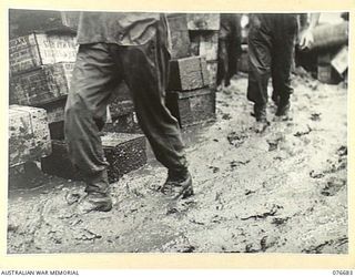 JACQUINOT BAY, NEW BRITAIN. 1944-11-05. THIS PHOTOGRAPHY GIVES SOME IDEA OF THE MUD AND SLUSH WHICH THE TROOPS OF THE 6TH INFANTRY BRIGADE HAD TO CONTEND WITH DURING THE UNIT LANDING OPERATIONS IN ..