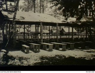 Torokina, Bougainville. 1945-08. Open air chapel built from native materials with basic seating and canvas roof