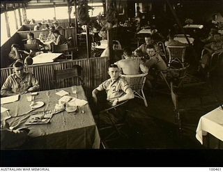 Ela Beach. New Guinea. 1944-05-22. Australian Army officers relaxing in the lounge room at the Officers' Club