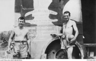 PORT MORESBY, PAPUA, 1942-1943. SERGEANT CLIFF FIELD (LEFT) WITH HIS BROTHER SERGEANT WAL FIELD STANDING BESIDE A TRUCK THAT SERVED AS ONE OF THE AUSTRALIAN ARMY AMENITIES SERVICE'S MOBILE CINEMAS. ..