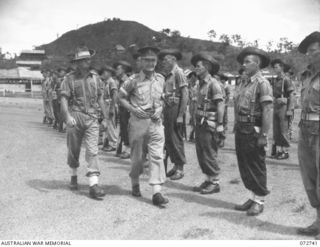 PORT MORESBY, NEW GUINEA. 1944-04-28. NX34705 BRIGADIER P. S. MCGRATH, OBE, DEPUTY DIRECTOR OF SUPPLY AND TRANSPORT, HEADQUARTERS NEW GUINEA FORCE (1), ACCOMPANIED BY THE COMPANY COMMANDER, QX6209 ..