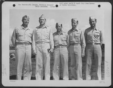 Brig. General Thomas J. Cushman, Usmc, Commanding General Of The Saipan Air Defense Command, And Colonel Lewis M. Sanders Of Chicage, Illinois, Commanding Officer Of The 318Th Fighter Group, Pose With Squadron Commanders Under The Command Of Colonel Sande (U.S. Air Force Number 3A49059)