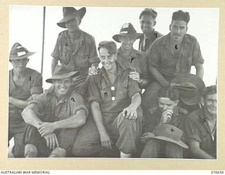 JACQUINOT BAY, NEW BRITAIN. 1944-11-04. THESE NINE MEMBERS OF D COMPANY, 14/32ND INFANTRY BATTALION WERE THE FIRST OFF THE TROOPSHIP, "CAPE ALEXANDER" WHEN THE VESSEL ANCHORED IN THE BAY. ..