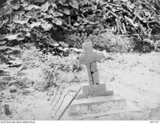 THE GRAVE OF CAPTAIN BRIAN COLDEN ANTILL POCKLEY, THE FIRST MEDICAL OFFICER KILLED IN THE 1914-18 WAR, IN THE RABAUL CEMETERY. MANY HEADSTONES IN THE AIF SECTION OF THE RABAUL CEMETERY WERE BROKEN ..