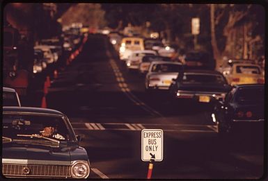 MORNING RUSH HOUR TRAFFIC TO HONOLULU FROM THE EAST ON KALANIANAOLE HIGHWAY. CLEAR (REVERSE FLOW) LANE IS RESERVED FOR BUSES