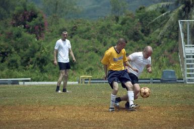 The US Navy (USN) Varsity Soccer team plays against the Russian Federation Navy (RFN) Soccer team, in an exhibition match at Blue Jacket Field, at Santa Rita, Guam (GU). RFN ships are in Guam participating in Exercise PASSEX 06, an exercise designed to increase interoperability between the two navies while enhancing the strong cooperative relationship between Russia and the United States