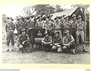 DUMPU, RAMU VALLEY, NEW GUINEA, 1944-02-09. THE SIGNAL SECTION ATTACHED TO 18TH INFANTRY BRIGADE HEADQUARTERS. IDENTIFIED PERSONNEL ARE: SX4125 LIEUTENANT N.F. BROOKS (1); VX6059 STAFF SERGEANT ..