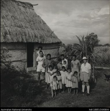 Field Officer with farmer and his family