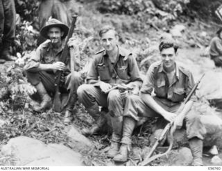 SALAMAUA AREA, NEW GUINEA. 1943-07-23. NCOS OF "A" COMPANY, 2/5TH BATTALION WHO WERE RECOMMENDED FOR DECORATIONS AFTER THE FIGHTING AT MOUNT TAMBU, RESTING AT BUIGAP CREEK. LEFT TO RIGHT: VX4026 ..