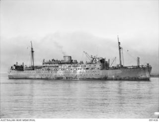 LAE, NEW GUINEA, 1945-05-07. THE MV DUNTROON ANCHORED OFF MILFORD HAVEN. THE VESSEL CARRIED 342 AWAS FROM AUSTRALIA TO LAE EN ROUTE TO THE AWAS BARRACKS AT BUTIBUM ROAD