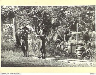 SIAR, NEW GUINEA. 1944-06-18. VX104114 CHAPLAIN C.T. SAMBELL, LEADING THE SINGING OF A HYMN, ACCOMPANIED BY VX89731 CORPORAL S.R. CHENERY ON HIS CORNET, DURING A CHURCH SERVICE IN THE 57/60TH ..