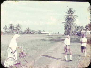 Nursing mission sister, Frank Mack and another agricultural officer at the airstrip at Cape Gloucester, Papua New Guinea, ca. 1951 / Albert Speer