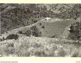 PORT MORESBY, PAPUA, NEW GUINEA. 1944-03-27. NO.1 GUN BOOTLESS BATTERY, COAST ARTILLERY VIEWED FROM NO.2 GUN AT THE BATTERY