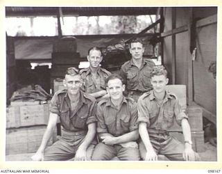 TOROKINA, BOUGAINVILLE. 1945-10-19. THE STAFF OF ASSISTANT DIRECTOR ORDNANCE SERVICE DUMP, 3 DIVISION. IDENTIFIED PERSONNEL ARE:- PRIVATE W.G. JOHNSTONE (1); WARRANT OFFICER 1 R.N. CLARK (2); ..