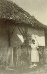 A woman in front of a building of Moria Health center