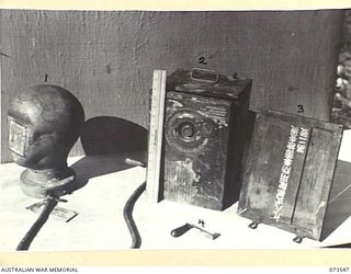 LAE, NEW GUINEA. 1944-06-02. JAPANESE RESPIRATORY EQUIPMENT AT HEADQUARTERS NEW GUINEA FORCE WHICH WAS CAPTURED IN MADANG DURING MAY 1944. THE SIZE OF THE EQUIPMENT CAN BE GAUGED FROM THE RULER IN ..