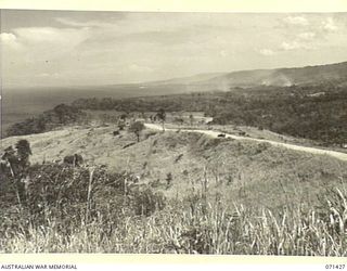 FINSCHHAFEN AREA, NEW GUINEA. 1944-03-21. A SECTION OF A PANORAMA FROM WITHIN THE AREA OF HEADQUARTERS, 2ND AUSTRALIAN CORPS, NORTH HILL IN THE FOREGROUND WITH SCARLET BEACH AND SATTELBERG AWAY TO ..