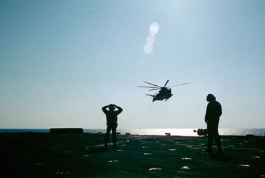 A CH-46 Sea Knight helicopters approaches to land aboard the amphibious assault ship USS GUAM (LPH 9) during operations off the coast of Beirut, Lebanon