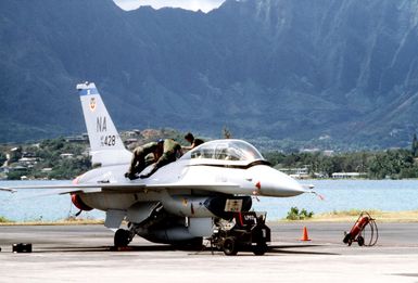 A right front view of an F-16 Fighting Falcon aircraft undergoing maintenance during exercise COPE ELITE '81. The Falcon is from the 428th Tactical Fighter Squadron, 474th Tactical Fighter Wing