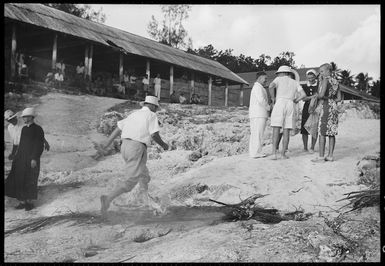 Walking through fire and smoke to prevent the spread of disease, Mauke Island, Cook Islands - Photograph taken by Mr Malloy