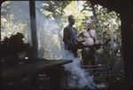 Orofere Valley, Tahiti: archaeologist Kenneth Emory and Tahitian man, cook house in foreground