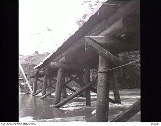 DONADABU, NEW GUINEA. 1943-11-03. NEW EIGHT SPAN WOODEN BRIDGE OVER THE LALOKI RIVER CONSTRUCTED BY THE SAPPERS OF THE 24TH AUSTRALIAN FIELD PARK COMPANY, ROYAL AUSTRALIAN ENGINEERS