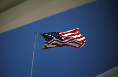 A view of the US flag flying above the USS ARIZONA Memorial