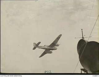 AT SEA BETWEEN GOODENOUGH ISLAND AND THE TROBRIAND ISLANDS, PAPUA. 1943-11-27. AN AIRCRAFT OF NO. 8 (BEAUFORT TORPEDO BOMBERS) SQUADRON RAAF MADE MOCK ATTACKS AND PRACTICE STRAFING RUNS ACROSS THE ..