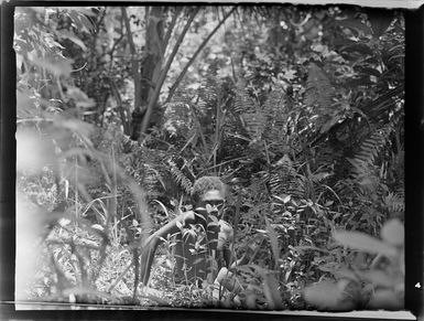 An unidentified boy in native bush, Vanuatu