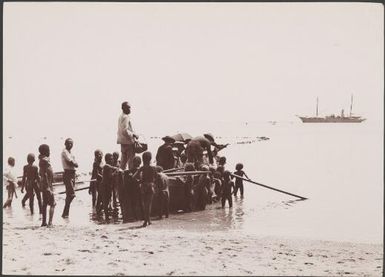 Passengers departing for the Southern Cross via boat at Lamalana, Raga, New Hebrides, 1906 / J.W. Beattie