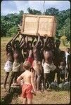 A crate arrives, Keesing child in foreground