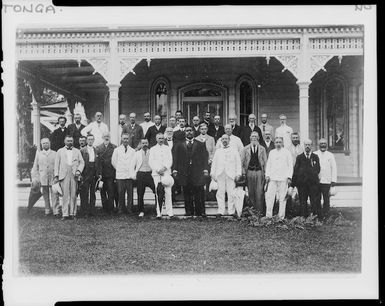 King George and party outside palace during Charles Houghton Mill's visit to Nukualofa, Tonga