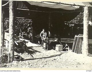 VX132323 CRAFTSMAN W.J. TOMLINSON (1) AND VX144099 CRAFTSMAN H.C. COOPER (2) WORKING IN THE CARPENTER'S SHOP OF THE 109TH BRIGADE WORKSHOPS