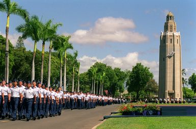 Freedom Tower at Hickam AFB serves as a picturesque background for the pass in review of troops at the PACAF change of command ceremony