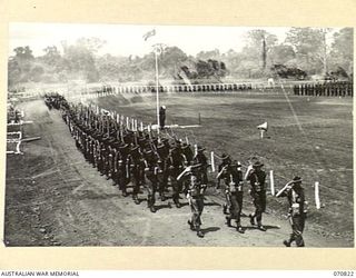 LAE, NEW GUINEA, 1944-03-08. GENERAL VIEW OF THE MARCH PAST OF HEADQUARTERS, 29TH INFANTRY BRIGADE AS VX20308 MASJOR-GENERAL F.H. BERRYMAN, CBE, DSO, GENERAL OFFICER COMMANDING 2ND AUSTRALIAN CORPS ..