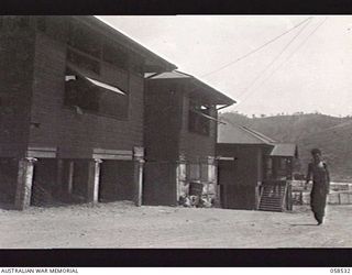 HANUABADA, NEW GUINEA. 1943-10-23. AUSTRALIAN AND NEW GUINEA ADMINISTRATION UNIT, STORES AND SUPPLY BUILDINGS, WHICH IN ADDITION TO ADMINISTERING THE NATIVE POPULATION, SUPPLIES RATIONS FOR NATIVES ..