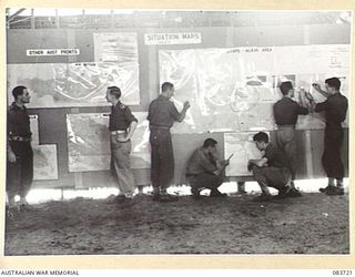 AITAPE, NEW GUINEA. 1944-11-22. LARGE SCALE MAPS OF THE AREA IN THE BATTLE ROOM AT HQ 6 DIVISION. THE MAPS PROVIDE DETAILS OF EVENTS AMENDED AT 0700 HOURS EACH MORNING